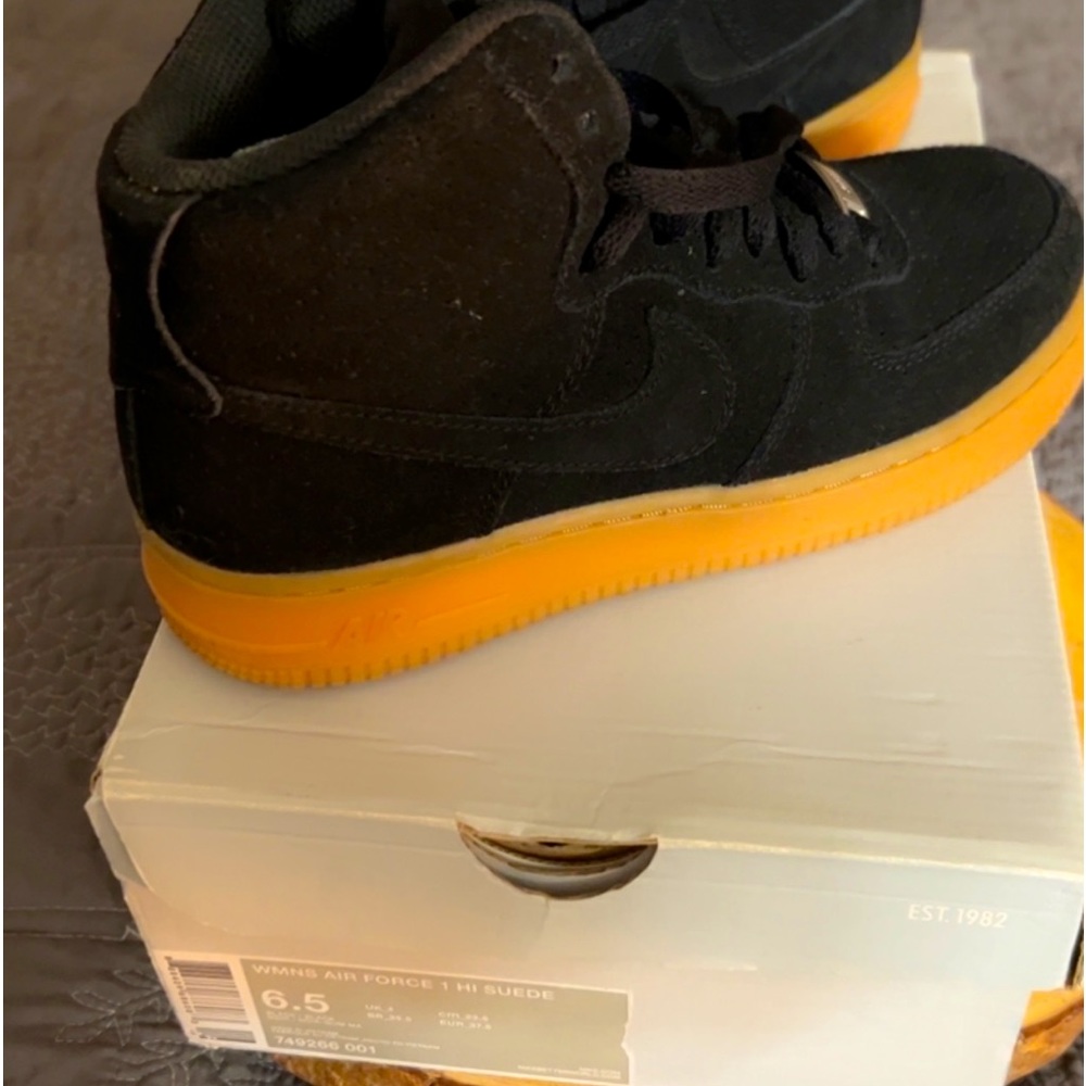 Woman’s size 6.5 Air Force high top.